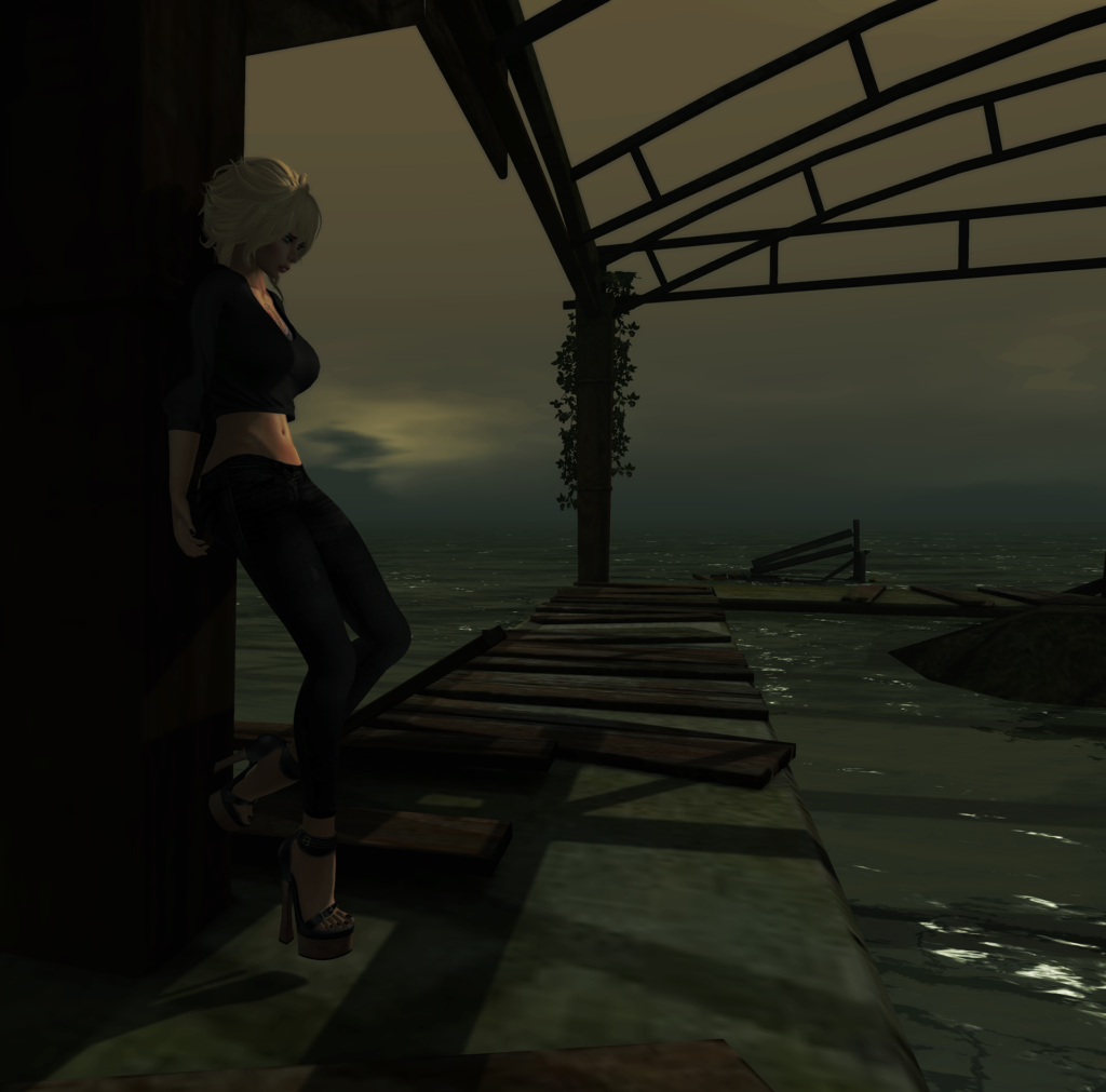 A female Second Life avatar stands in the wreckage of an amusement park.