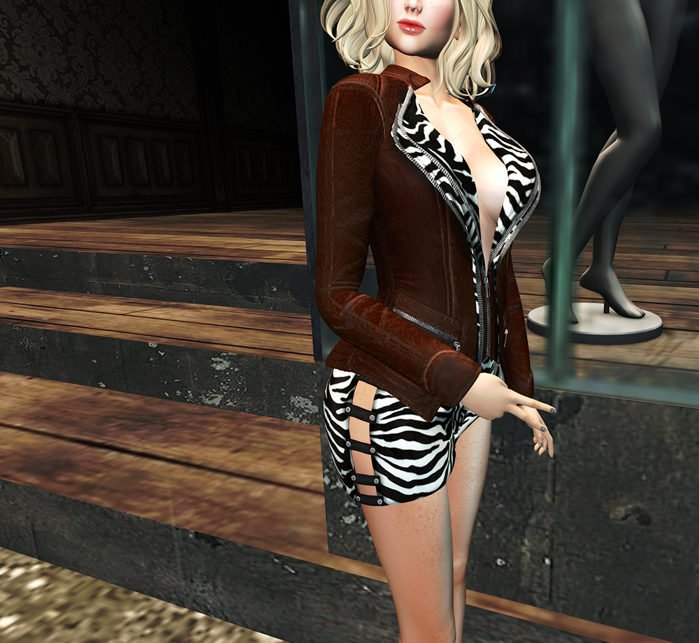 A female Second Life avatar shows off her leather and zebra jacket.