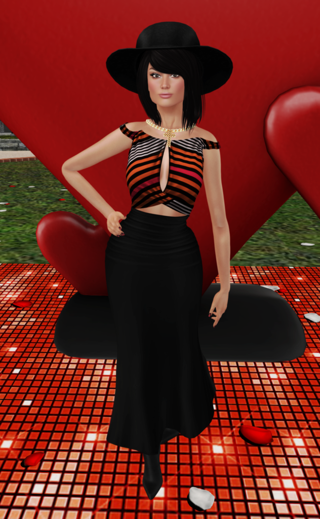 A female Second Life avatar stands in front of a heart while wearing a large hat, a striped top, and a black skirt.