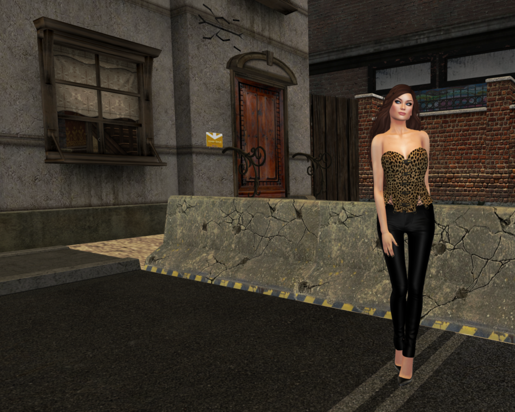 A female Second Life avatar stands in an alley while wearing black leather pants and a cheetah print corset.