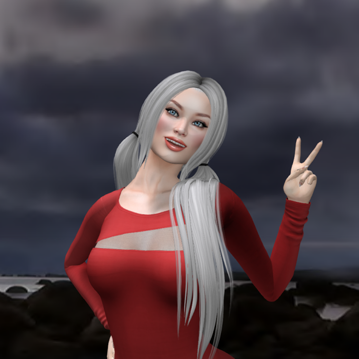 A Second Life avatar with long grey ponytails and a red dress gives a peace sign at the beach.
